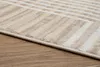 A close-up view of a rug with a striped pattern, placed on a wooden floor. Anteprima dell’immagine prodotto
