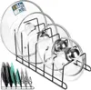 A black metal rack holding several pot lids and plates. Voir les images du produit