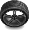 A black tire on a dark gray rim, isolated on a white background. Podgląd zdjęcia produktu