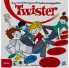 The image shows the packaging of the Twister game, featuring cartoon characters playing the game. Produktbild-Vorschau