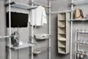 A modular closet system with shelves, hanging space, and storage units. Produktbild-Vorschau