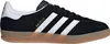 A side view of a black Adidas Gazelle sneaker with white stripes and a gum sole. Produktbild-Vorschau