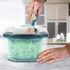 A person is using a salad spinner in a kitchen. Anteprima dell’immagine prodotto