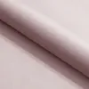 A close-up view of a pink fabric, showing its texture and folds. Produktbild-Vorschau