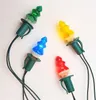 Four Christmas lights shaped like trees in different colors (green, blue, red, yellow) are arranged on a white background. Podgląd zdjęcia produktu
