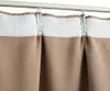 A close-up view of a taupe curtain hanging from a white curtain rod. Náhľad obrázku produktu