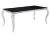 A rectangular dining table with a black top and chrome legs on a white background. Náhled obrázku produktu