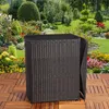 A dark brown rattan side table with a black top sits on a wooden deck in a lush garden setting with colorful flowers and greenery. Anteprima dell’immagine prodotto