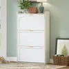 A white shoe cabinet with three flip-down doors is shown in a room with light green walls. Náhled obrázku produktu
