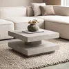 A modern living room setting with a couch and coffee table. Produktbild-Vorschau
