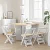 A dining set with a table and chairs in a bright room with a window. Produktbild-Vorschau