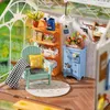 A miniature greenhouse interior with furniture and decorative items. Anteprima dell’immagine prodotto