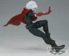 A figurine of a character with white hair, wearing a red cape and black outfit, in a dynamic pose against a plain gray background. Náhled obrázku produktu