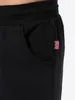 Close-up of the pocket area of black trousers. Produktbild-Vorschau