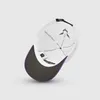 The underside of a white baseball cap with a black brim and purple trim. Anteprima dell’immagine prodotto