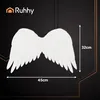 A pair of white angel wings with dimensions indicated. Produktbild-Vorschau