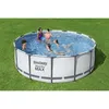 A group of people are enjoying themselves in an above-ground swimming pool set up on a grassy lawn. Produktbild-Vorschau
