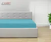A turquoise fitted sheet on a bed with a white headboard. Produktbild-Vorschau