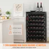 A black 7-tier bamboo wine rack holding 42 bottles is shown in a room, with a countertop and a framed picture in the background. Produktbild-Vorschau