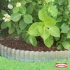 A garden bed with a corrugated metal border separating grass from mulch and plants. Produktbild-Vorschau