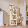 A tall, multi-level cat tree with three cats on it, placed in a room corner. Podgląd zdjęcia produktu