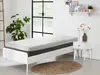 A bedroom scene with a mattress on a bed frame, a nightstand with a vase of flowers, and a plant. Produktbild-Vorschau