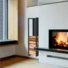 A modern living room with a fireplace and a wood storage rack. Podgląd zdjęcia produktu