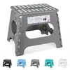 A gray folding step stool is shown with several other colored stools of the same type displayed below. Produktbild-Vorschau