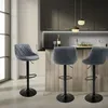 A modern kitchen island with bar stools. Produktbild-Vorschau