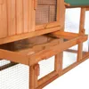 A close-up view of a wooden animal hutch, showing a pull-out tray and wire mesh. Produktbild-Vorschau