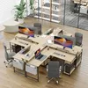 A modern office space with multiple L-shaped desks, computers, and chairs. Náhled obrázku produktu