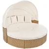 A round, outdoor daybed with a canopy and cushions, set against a white background. Voir les images du produit