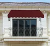 A burgundy awning is installed above a balcony with glass doors on a white building. Anteprima dell’immagine prodotto