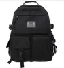 A black backpack is shown from the front against a white background. Náhľad obrázku produktu