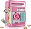 A pink electronic piggy bank with a keypad and a slot for money, with dollar bills and coins displayed around it. Náhľad obrázku produktu