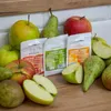 A close-up shot of various apples and pears arranged around three bags of Browin cider yeast. Produktbild-Vorschau