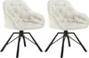 Two cream-colored swivel chairs with black metal legs are shown against a white background. Náhľad obrázku produktu