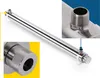 A stainless steel water purification device with two close-up insets showing details of its connectors. Produktbild-Vorschau