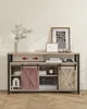 A TV stand with sliding doors, decorated with framed art and a vase of plants. Voir les images du produit