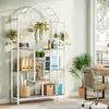 A well-lit room with a desk and a plant stand filled with plants and office supplies. Anteprima dell’immagine prodotto