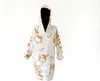 A hooded blanket with a corgi and bone pattern, displayed on a white background. Anteprima dell’immagine prodotto