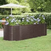 A raised garden bed filled with purple hydrangeas sits on a green lawn, with a white umbrella and patio furniture in the background. Produktbild-Vorschau