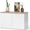 A white and wood-colored cabinet with decorative items on top. Náhled obrázku produktu