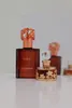 Two perfume bottles are displayed on a white surface with a light gray background. Voir les images du produit
