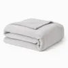 A folded light gray blanket on a white background. Produktbild-Vorschau
