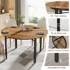 A round dining table with chairs, set in a room with a window view. Podgląd zdjęcia produktu