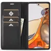 A black leather wallet-style phone case is open, showing card slots and a bill. A smartphone is inserted into the case. Produktbild-Vorschau
