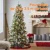 A decorated Christmas tree with presents underneath, next to a fireplace with stockings. Anteprima dell’immagine prodotto