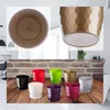 A collage of product images showing multiple colorful plant pots with saucers, and close-ups of two gold pots. Anteprima dell’immagine prodotto
