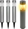 Four stainless steel solar garden lights on a white background. Three are unlit and one is lit with a yellow glow. Anteprima dell’immagine prodotto